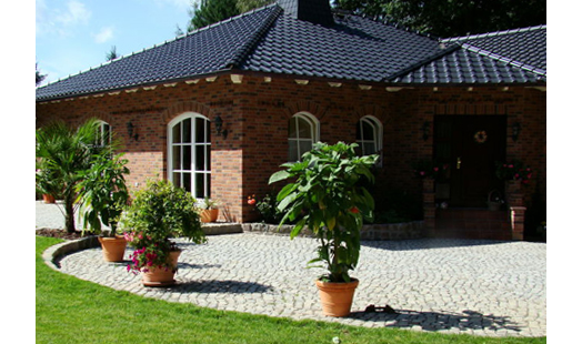 Detlef Woit Erd-, Tiefbau und Pflasterarbeiten in Wildenbruch Gemeinde Michendorf - Logo